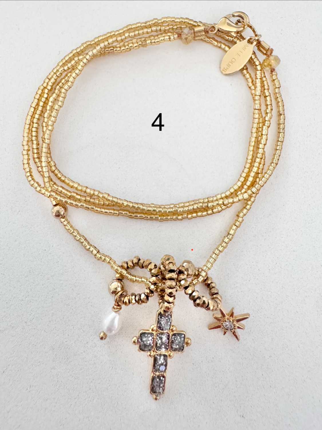 ICON-04-collier-croix-paillettes-argentees Collier ICON 04 Mademoiselle Oups, collier doré avec croix émaillée de paillettes argentées, perle de culture et étoile en strass