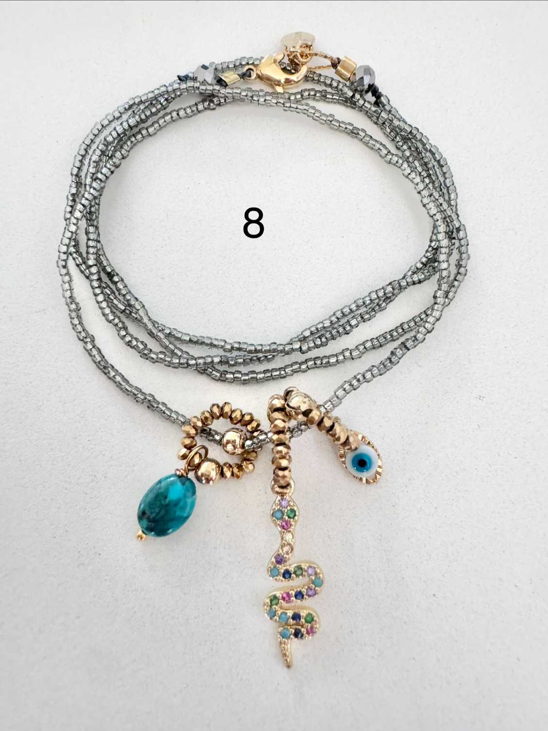 ICON-08-collier-serpent-turquoise Collier ICON 08 Mademoiselle Oups, collier gris avec serpent serti de cristaux, œil protecteur et pierre en turquoise du Nevada